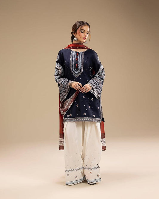 Woman wearing a navy blue embroidered kurta with white pants House of Beenora |  Best women clothing brand in Pakistan