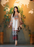 Woman in traditional embroidered outfit standing in front of a world map backdrop