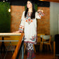 Woman in a traditional outfit standing in a casual indoor setting House of Beenora |  Best women clothing brand in Pakistan