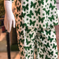 Green butterfly pattern on white pajama set worn by a mannequin.