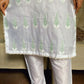Person wearing a light-colored kurta with green patterns and white pants House of Beenora |  Best women clothing brand in Pakistan