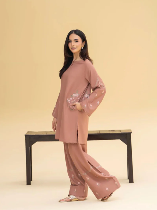 Woman wearing a pink outfit with floral patterns House of Beenora |  Best women clothing brand in Pakistan