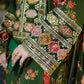 Close-up of a green embroidered garment with floral patterns House Of Beenora | Best women clothing brand in Pakistan